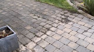 The before and after effects of using a pressure washer on a patio