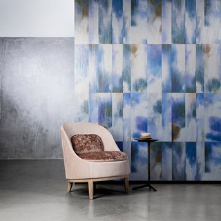 room with printed wall and chair with cushion