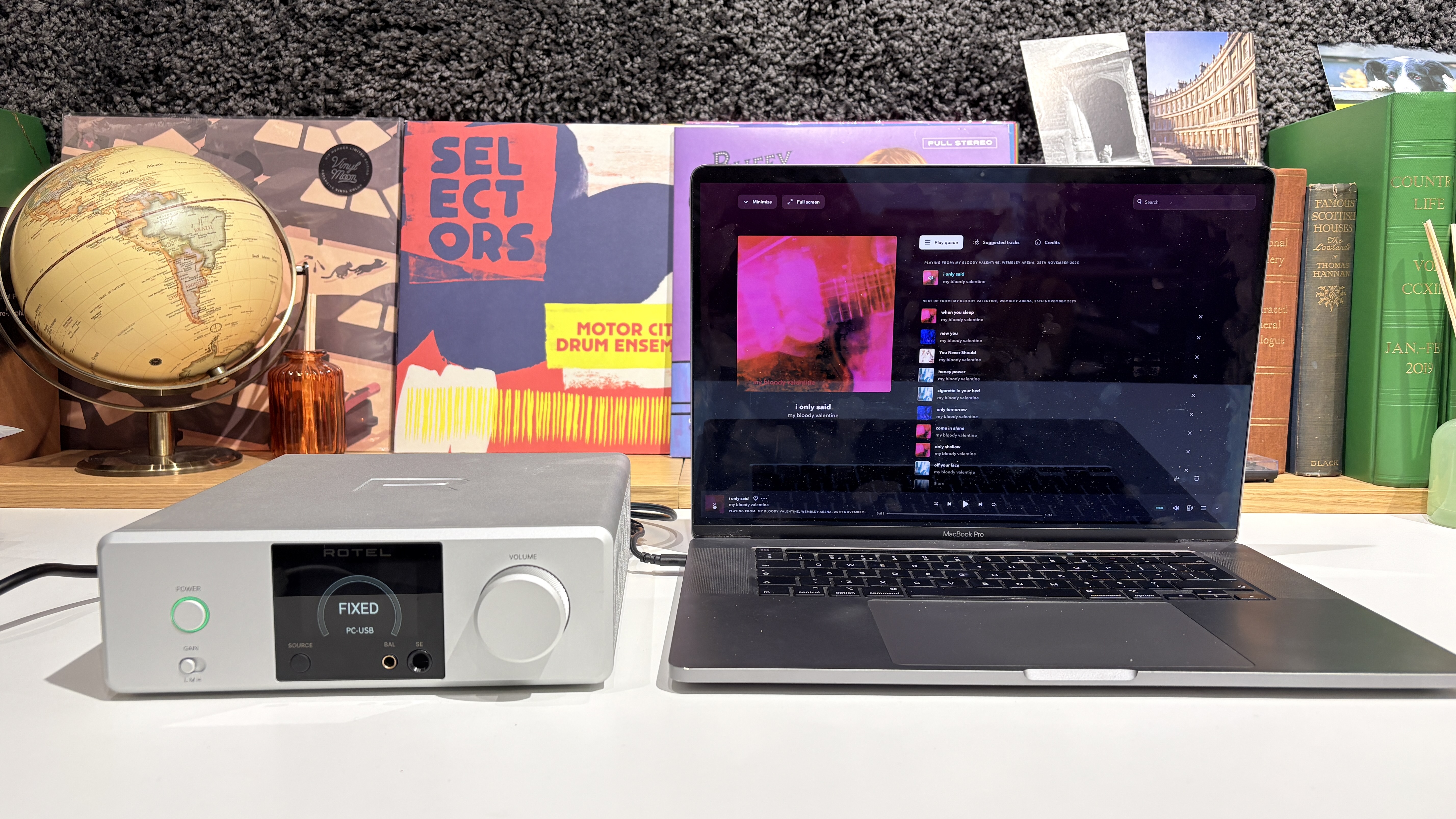 Rotel DX-3 on white desk next to MacBook laptop