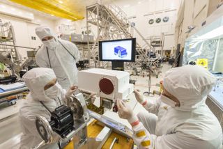 Engineers at NASA's Jet Propulsion Laboratory prepare the Mars 2020 rover for its launch next summer with the installation of the remote-sensing masthead and integration of two Mastcam-Z high-definition cameras. 