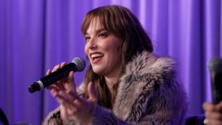 Lzzy Hale smiling and chatting