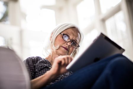 senior woman using tablet