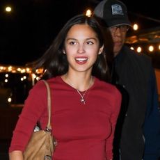 Olivia Rodrigo wearing a red T-shirt and leopard-print pants in NYC