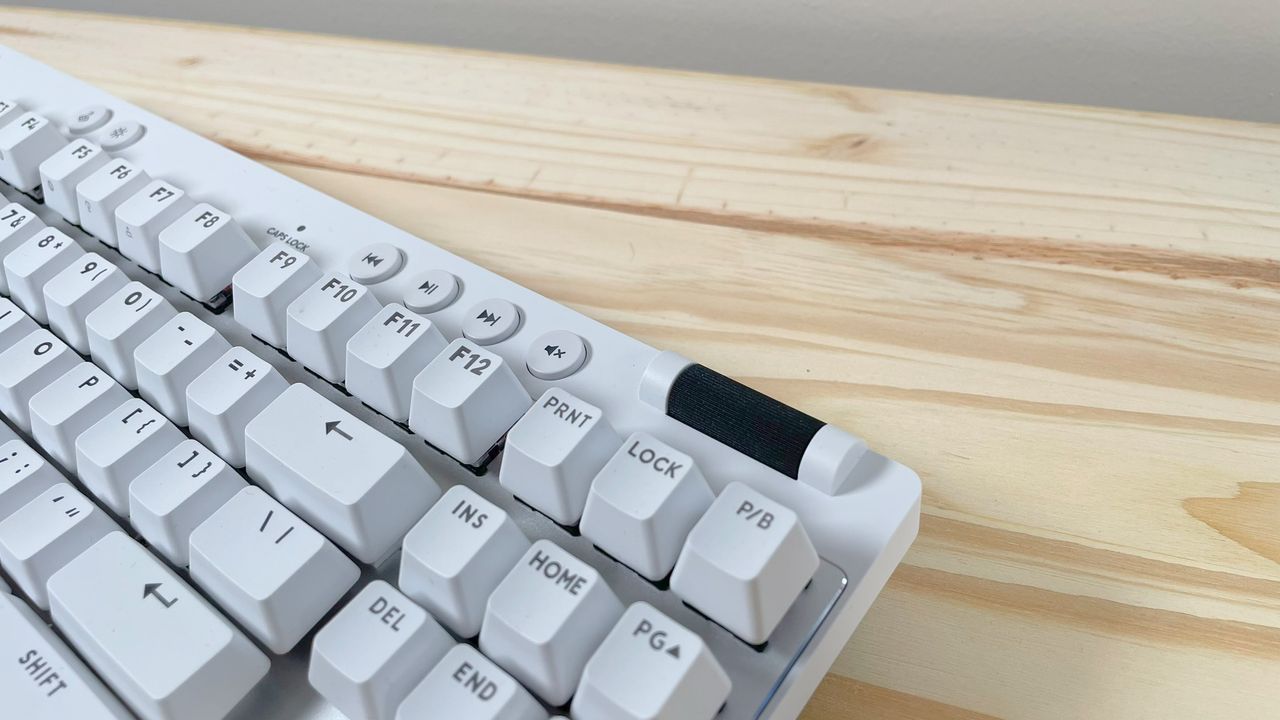 Close up of the scroll wheel and media buttons on the white Logitech G PRO X TKL Rapid gaming keyboard