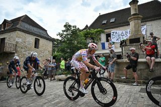 Uno-X Mobility team's Norwegian rider Jonas Abrahamsen (second-placed in the category) cycles in a breakaway during the 12th stage of the 111th edition of the Tour de France cycling race, 203,6 km between Aurillac and Villeneuve-sur-Lot, southern central France, on July 11, 2024. (Photo by Marco BERTORELLO / AFP)