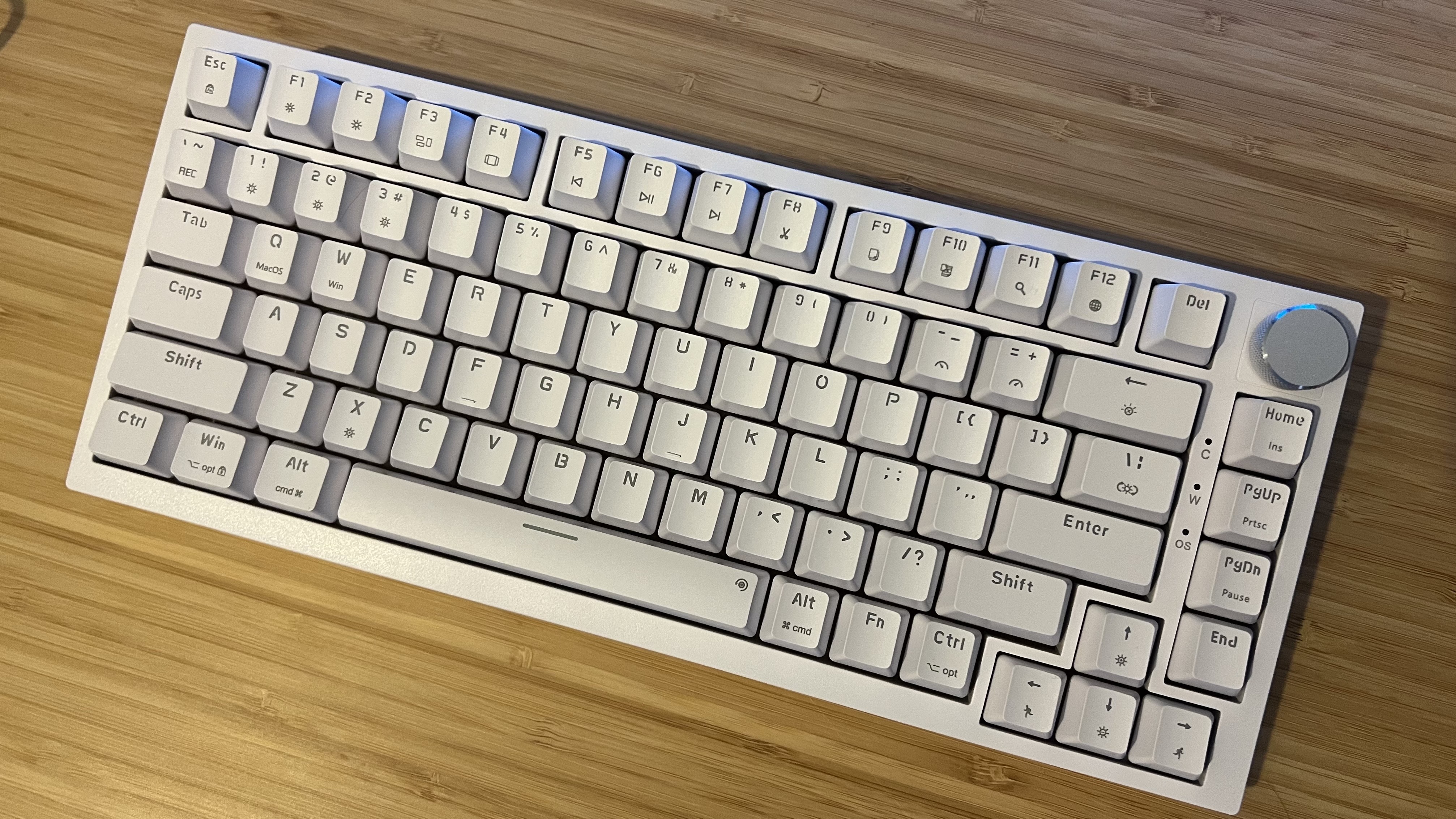 Newmen GM326 gaming keyboard on a wooden desk