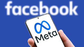 Meta logo on screen of mobile phone on Facebook word background. Facebook after rebranding and changing name to Meta.
