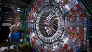 A giant circular computing machine hollow in the center where a thin copper tube passes through. It&#039;s like the retina of a giant robot eye.