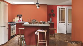 kitchen with red and orange colour scheme by dulux