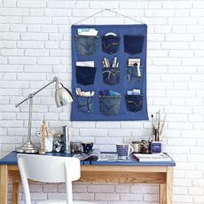 office home white brick designed tiles on wall table with chair and jeans pocket