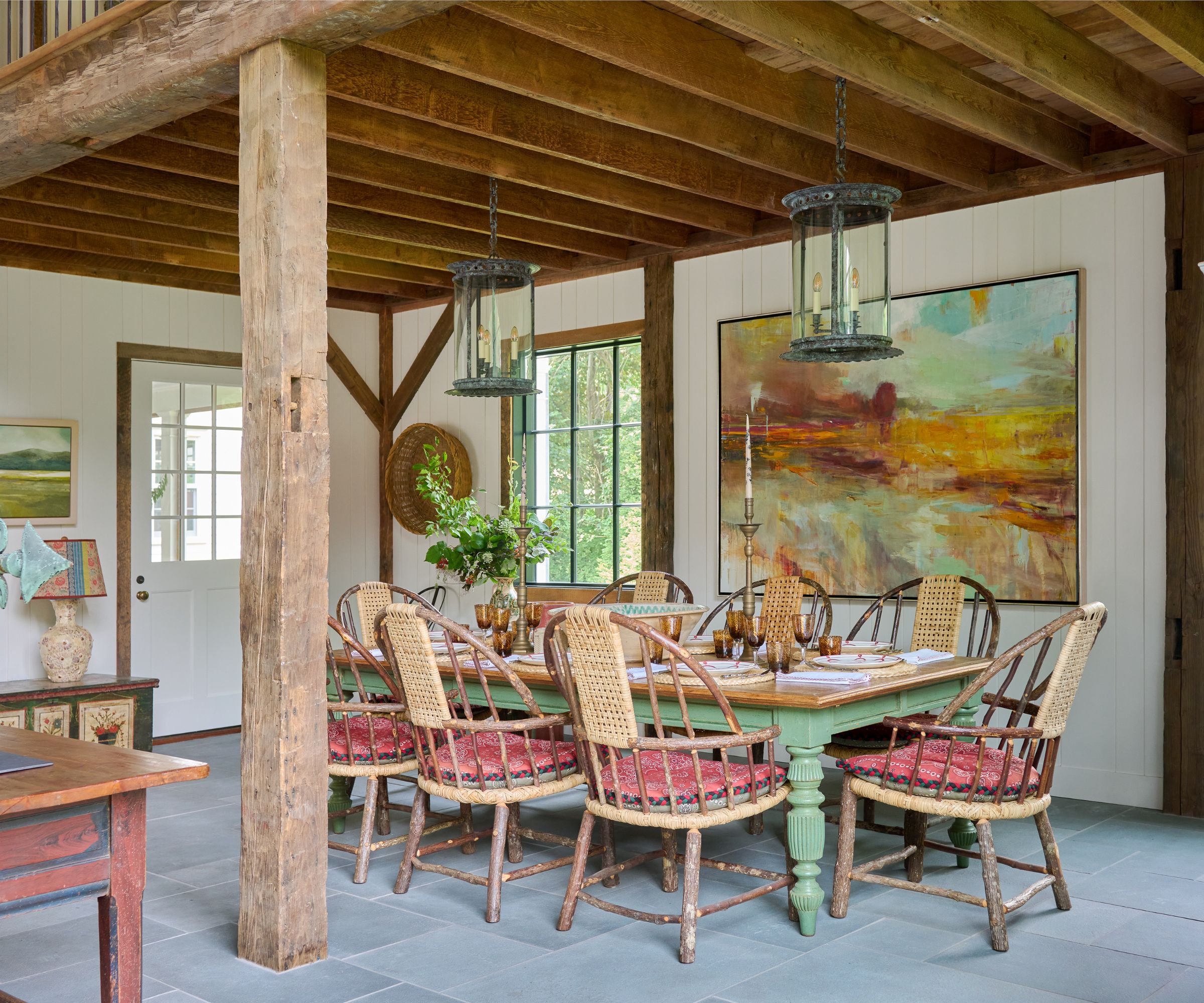 Dining room with beams and vintage furniture with pale green dining table