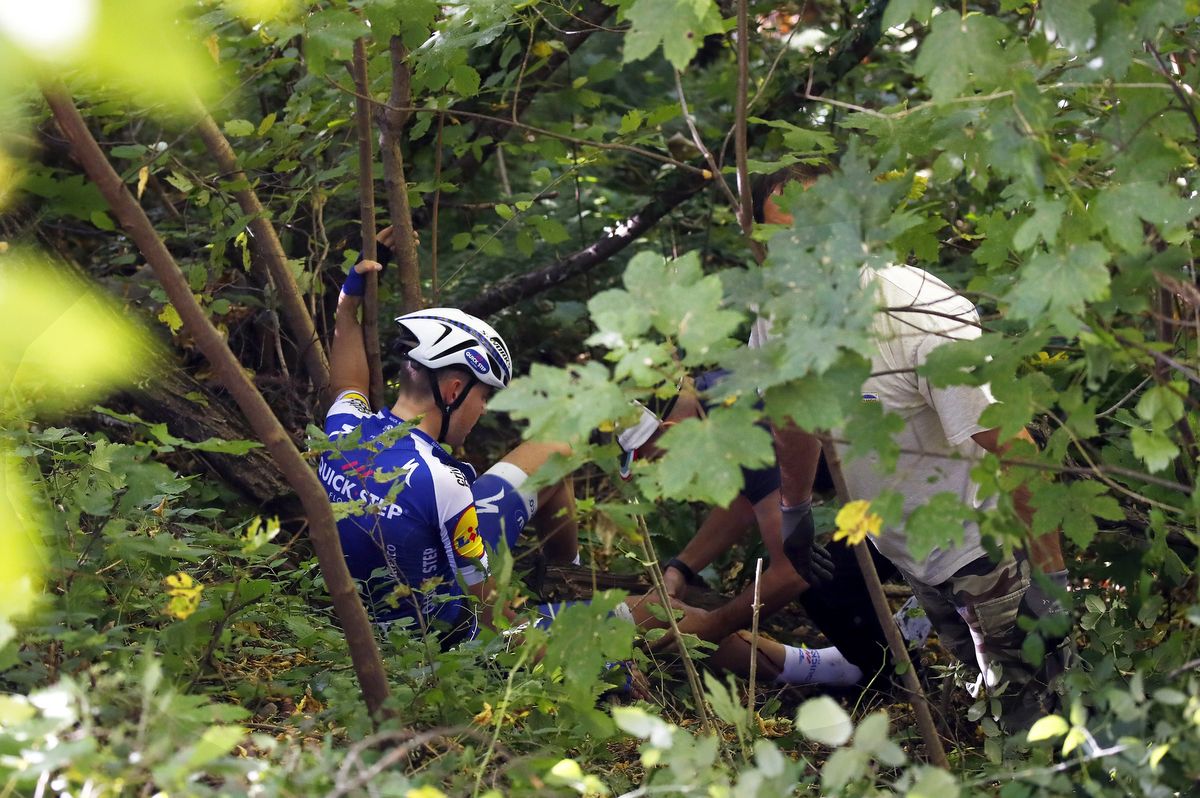 Laurens De Plus (Quick-Step Floors) receives treatment on his injured knee