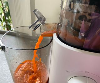 Carrot juice being made in the Nama J3 Juicer