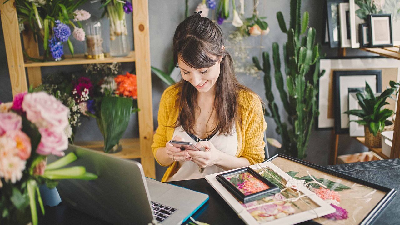 The owner of a plant store balances her books.