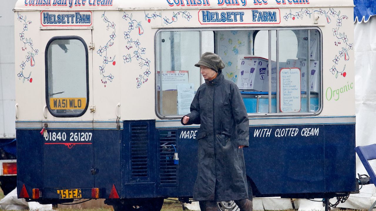 Princess Anne, Princess Royal walk past an ice cream stall as she attends the Gatcombe Horse Trials at Gatcombe Park on March 25, 2006 in Stroud, England. 