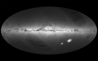 This all-sky view of the stars in our Milky Way galaxy, as well as neighboring galaxies, take center stage in this sky map by the European Space Agency's Gaia satellite during its first year of operation. 