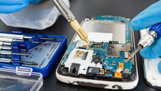 Repairing and upgrade Samsung mobile phone, electronic, computer hardware and technology concept.