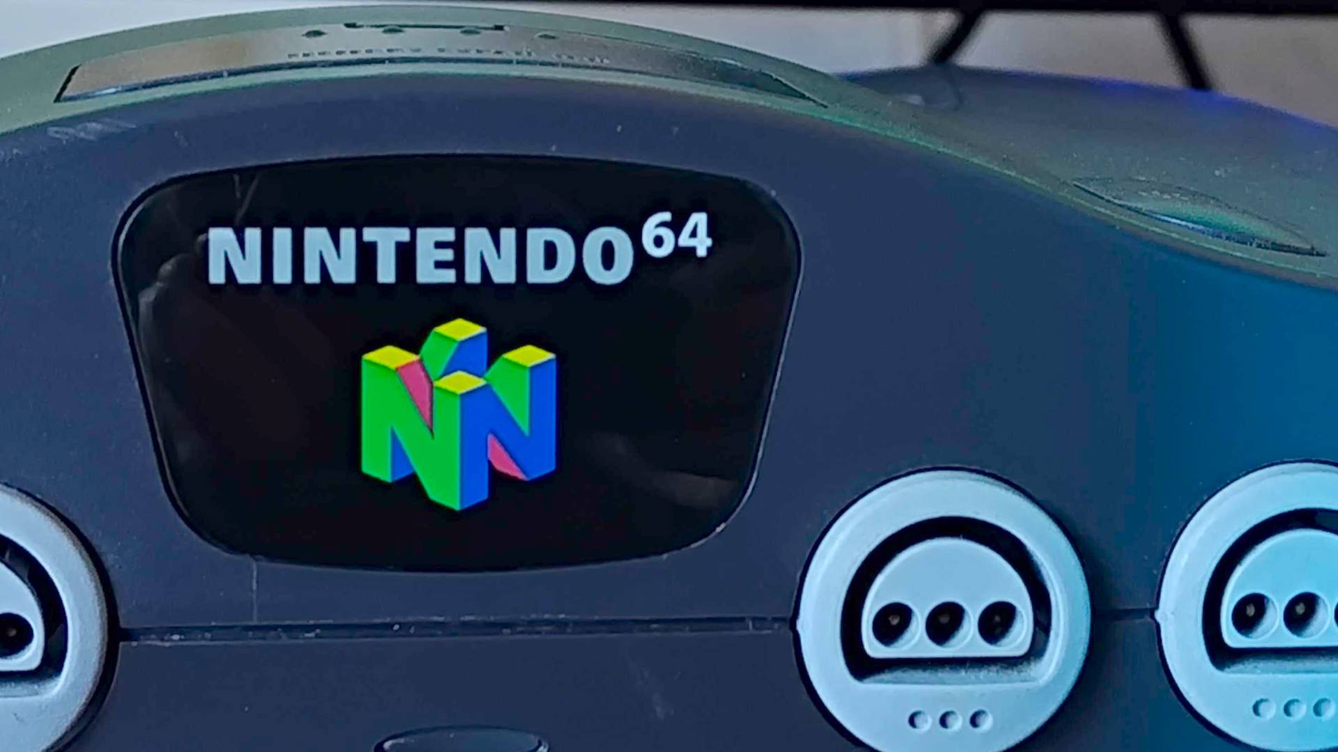 Close up of N64 jewel logo at front of console.