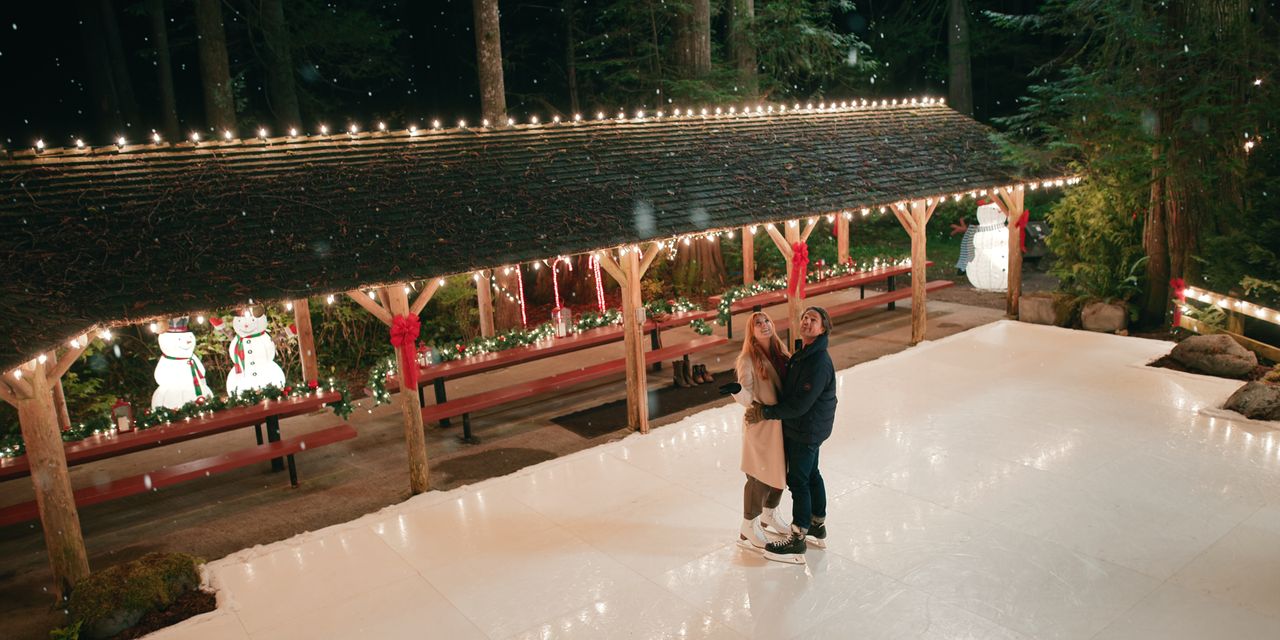 Mel and Jack embrace while ice skating.