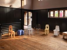 Max Lamb's chairs made of different materials are shown in a circle inside an old church hall