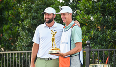 Scottie Scheffler and Ted Scott pose with The Players Championship trophy