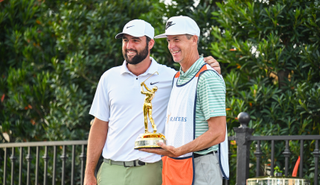 Scottie Scheffler and Ted Scott pose with The Players Championship trophy