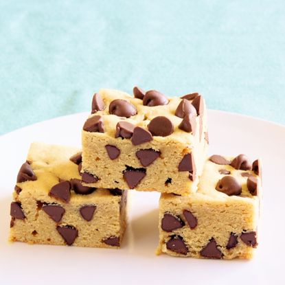 Three square of cookie dough fudge with chocolate chips