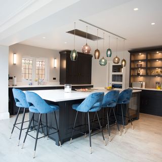 dining room with white table and blue chair