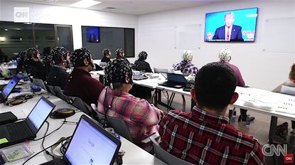 People in a focus group watch Donald Trump as researchers watch their brainwaves