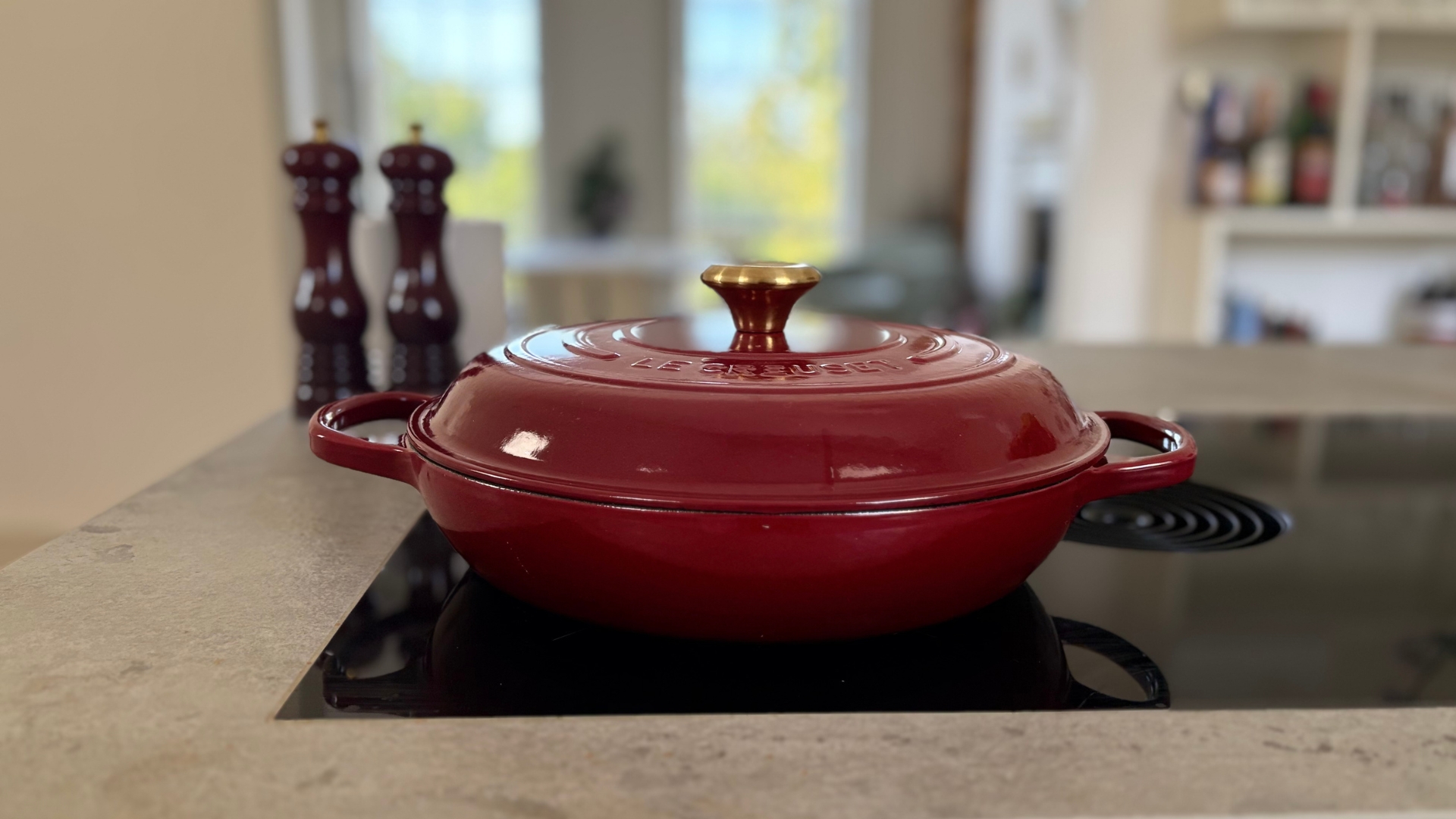 Le Creuset Shallow Casserole Dish with the Le Creuset Salt and Pepper Mills and Utensil Jar in the background