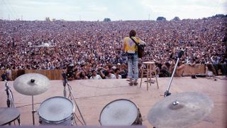 15 Aug 1969 --- John Sebastian performs at the Woodstock Music & Art Fair in Bethel, New York (Max Yasgur's 600-acre farm) on Friday, August 15, 1969. --- Image by © Henry Diltz/Corbis