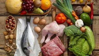 Various Paleo diet products on a wooden table