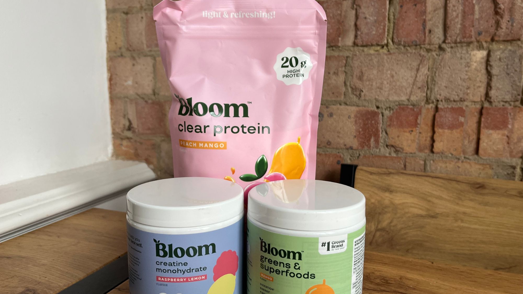 3 bloom supplements on wooden table