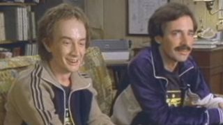 Martin Short and Harry Shearer sitting on a couch in "Synchronized Swimming" in SNL