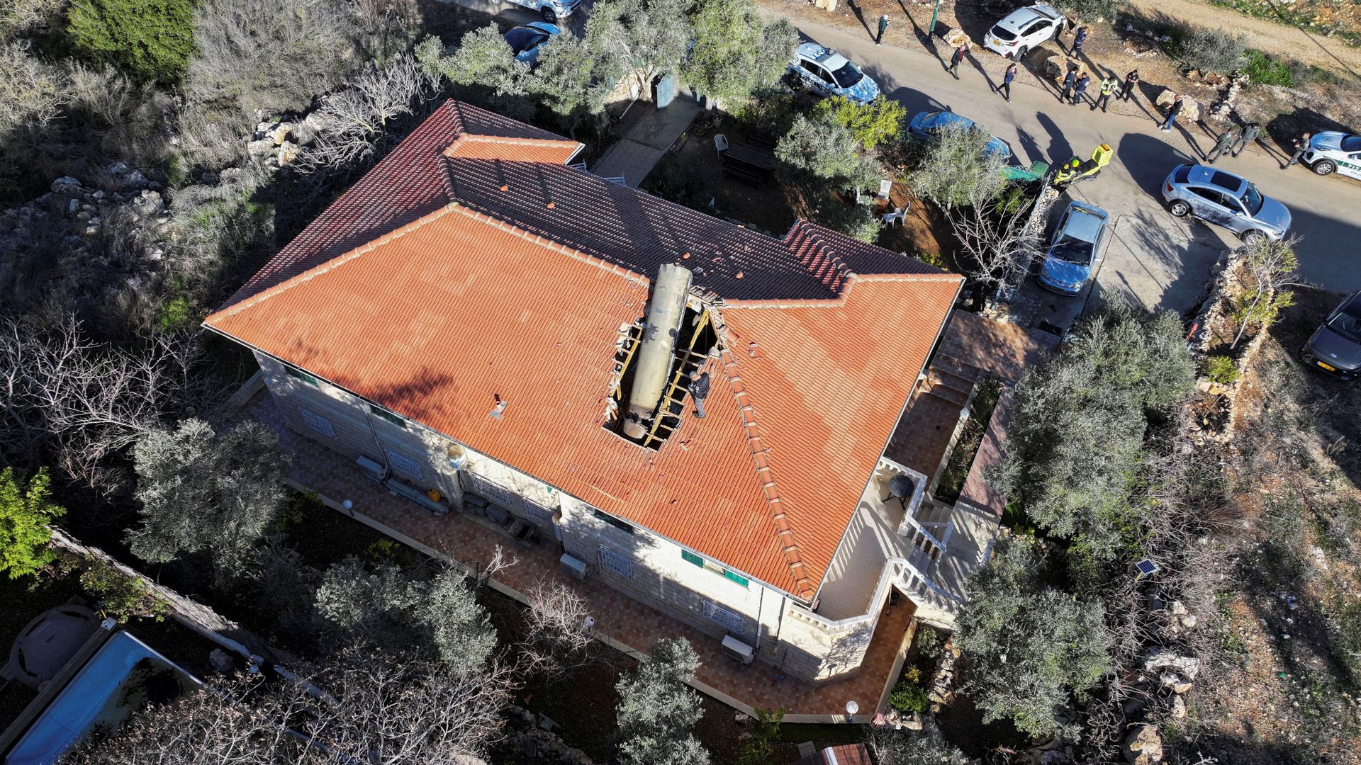 
                                A missile lands on the roof of a home in Mevo Beitar, Israel 
                            