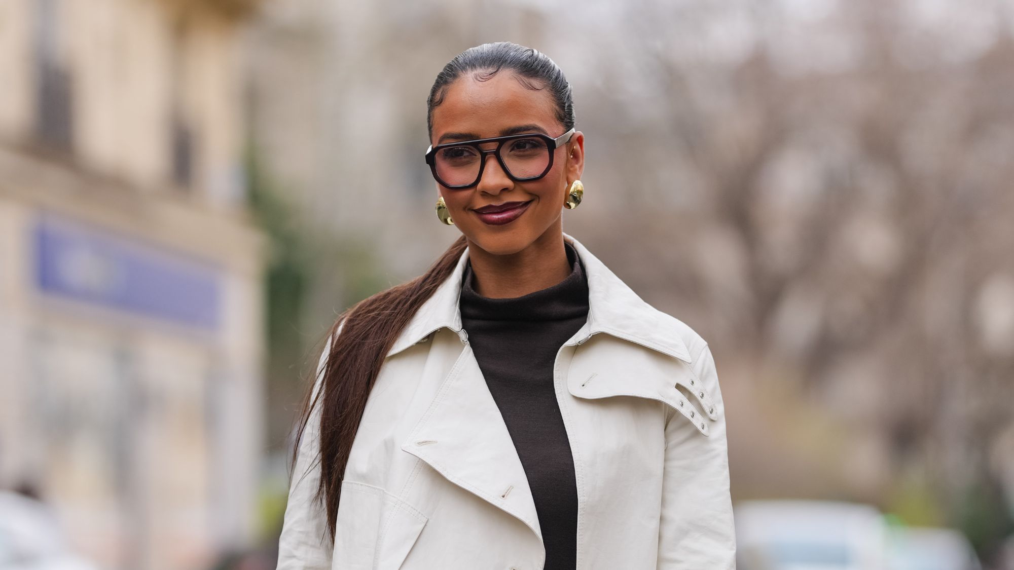 street style shot of a woman with glossy lips - best lip oils