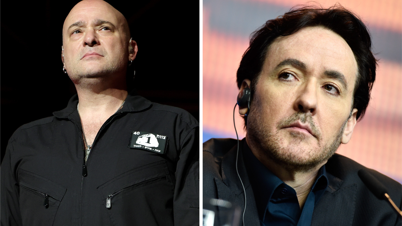 David Draiman of Disturbed onstage in 2025, next to a picture of John Cusack in 2016