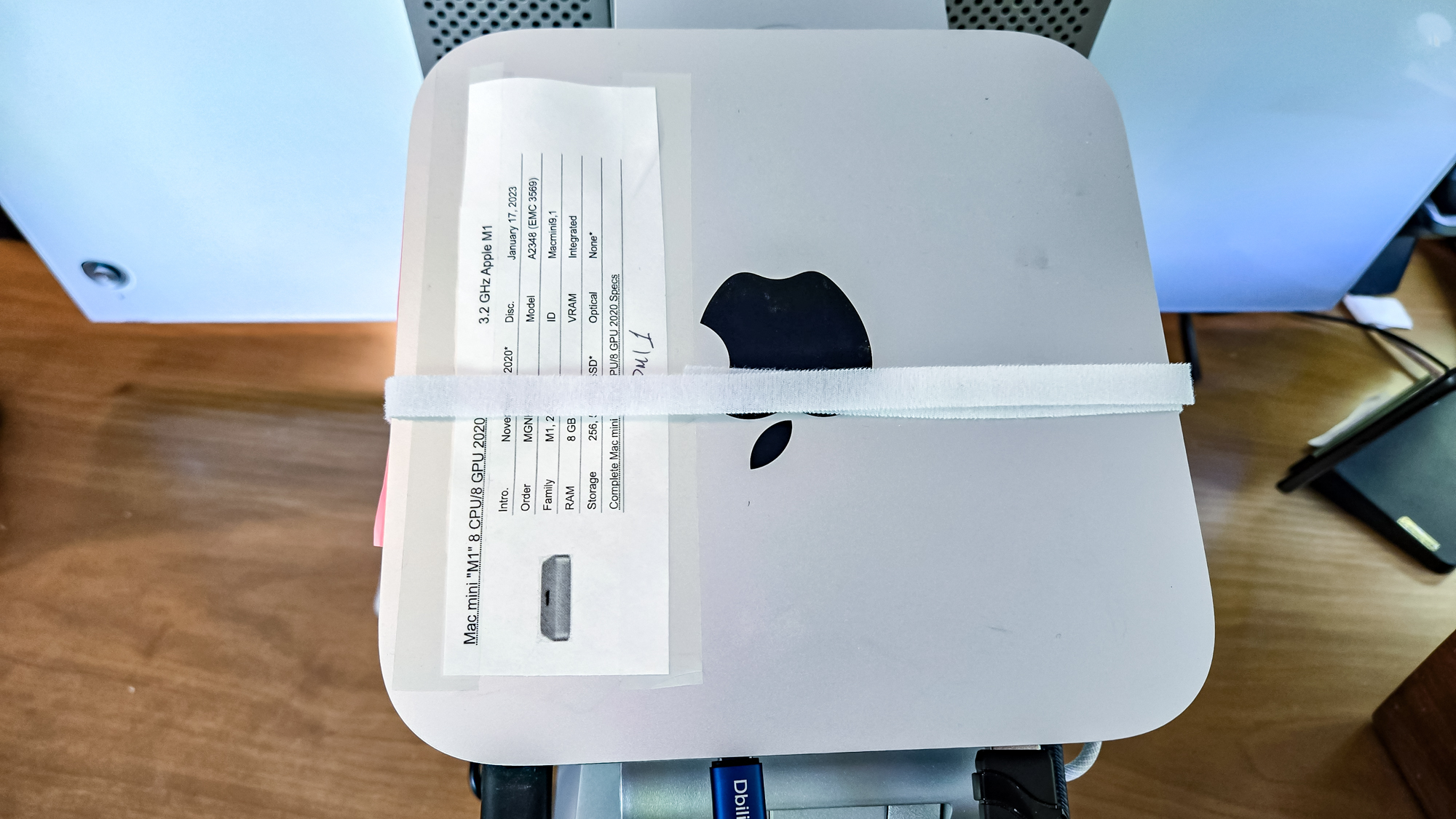 A Mac mini strapped to the stand of the ALogic Aspekt Touch 32-inch monitor