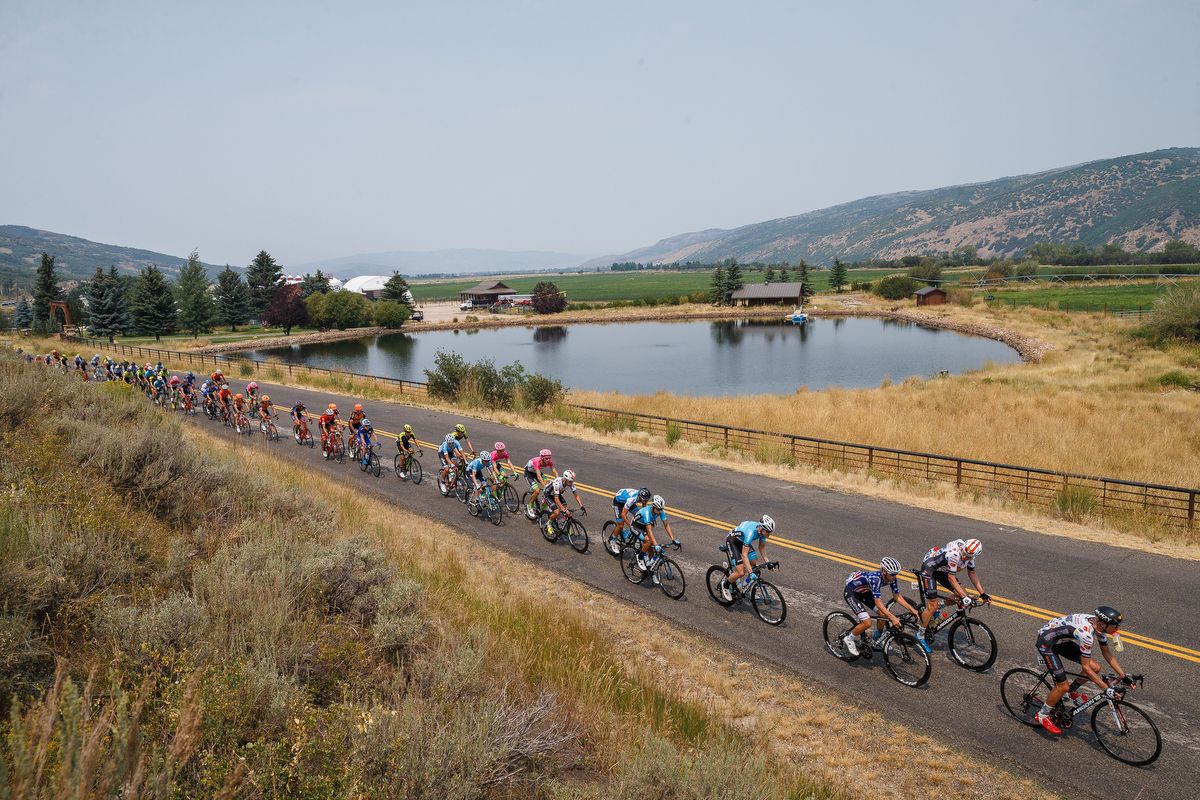 The peloton passes a pond during stage 5 at the Tour of Utah