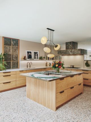 A mixed marble countertop in a transitional style kitchen
