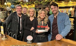 Emmerdale cast standing in the Woolpack with their TV Times award 