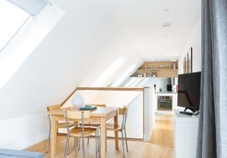 vaulted loft space with kitchen diner
