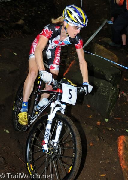 Catherine Pendrel (Canada) rides in second place on the start loop
