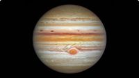 The gas giant Jupiter is pictured against a black background in an image captured by the Hubble Space Telescope. Multi-coloured cloud bands and storms are visible on its surface, as is the Great Red Spot.