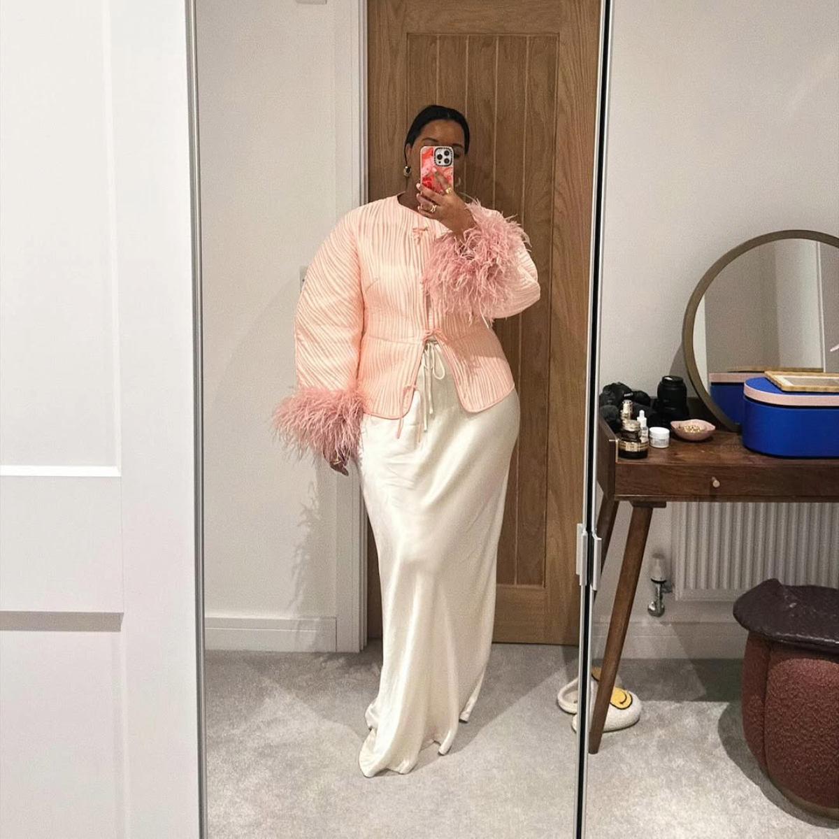 Karina in a feather jacket