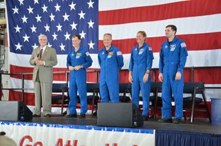 The final space shuttle crew members appear at their Houston homecoming. Left to right: Johnson Space Center director (and former astronaut) Mike Coats, commander Chris Ferguson, pilot Doug Hurley, and mission specialists Sandra Magnus and Rex Walheim.