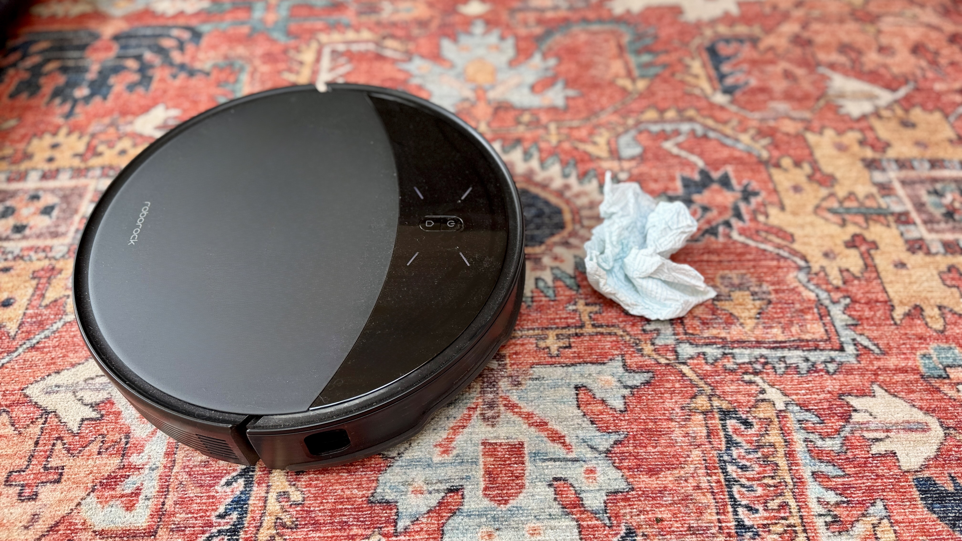roborock Saros 10 avoiding a tissue on a rug