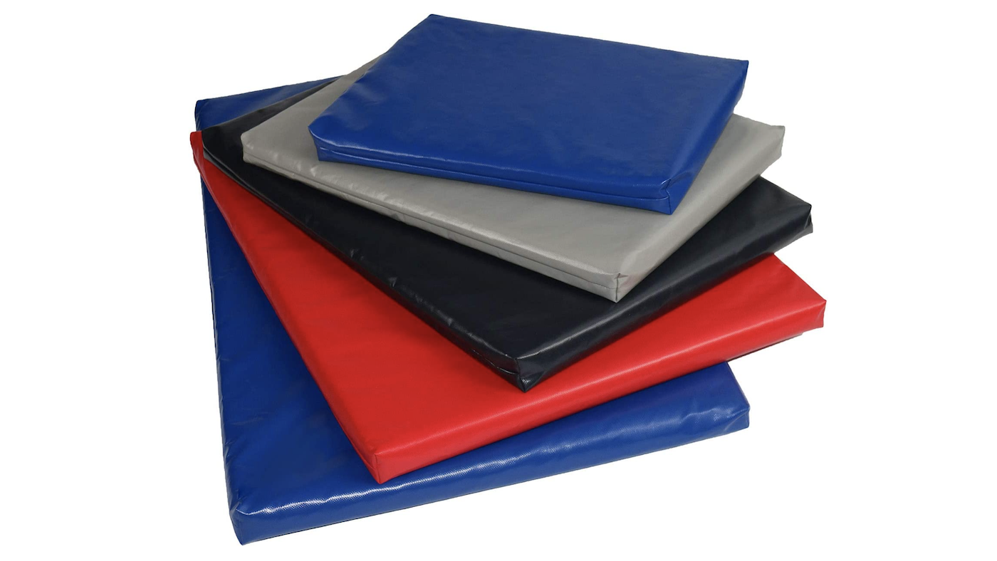 Pile of coloured mattresses for dog crate