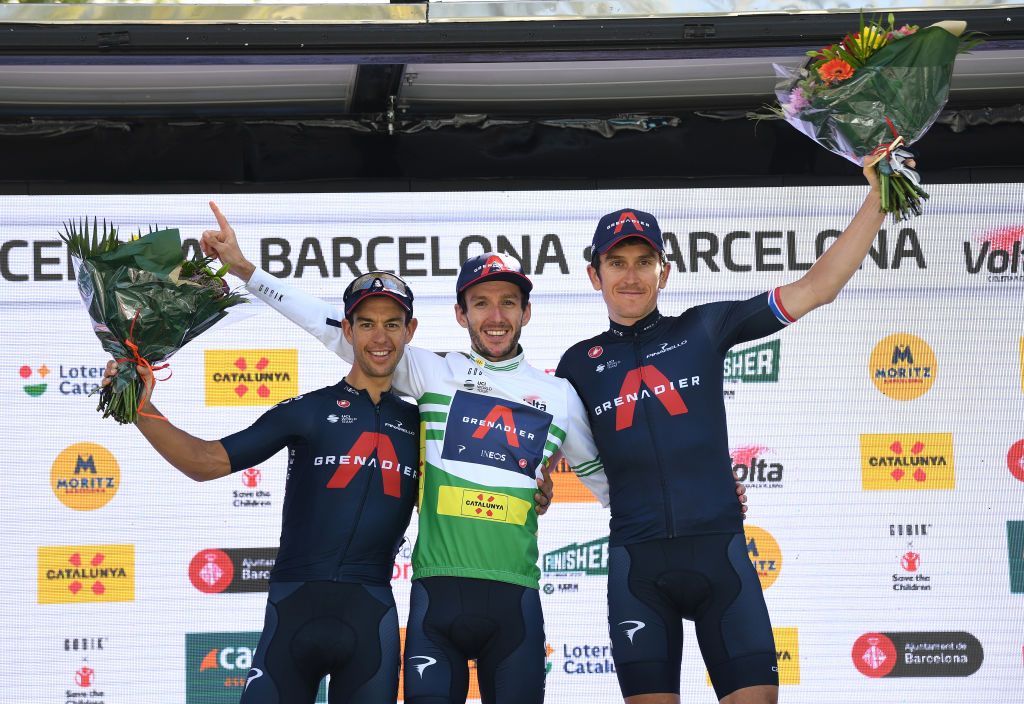 BARCELONA SPAIN MARCH 28 Podium Richie Porte of Australia and Team INEOS Grenadiers 2nd classified Adam Yates of United Kingdom and Team INEOS Grenadiers Green Leader Jersey Geraint Thomas of United Kingdom and Team INEOS Grenadiers 2nd classified Celebration during the 100th Volta Ciclista a Catalunya 2021 Stage 7 a 133km stage from Barcelona to Barcelona Mask Covid safety measures Flowers VoltaCatalunya100 on March 28 2021 in Barcelona Spain Photo by David RamosGetty Images