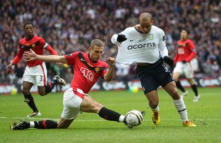 LONDON, ENGLAND - FEBRUARY 28: Gabriel Agbonlahor of Aston Villa is fouled by Nemanja Vidic of Manchester United to give away a penalty during the Carling Cup Final between Aston Villa and Manchester United at Wembley Stadium on February 28, 2010 in London, England. (Photo by Julian Finney - The FA/The FA via Getty Images)